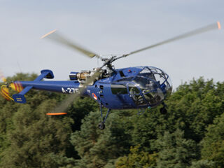 Bied op helikoptervlucht en lunch met Minister Hennis-Plasschaert