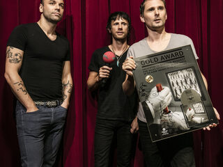 Bied op gouden plaat van Muse