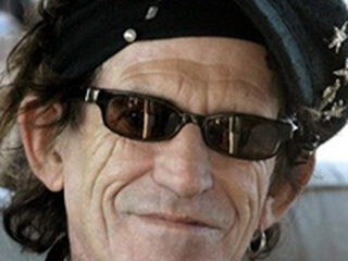 Keith krijgt gitaarles