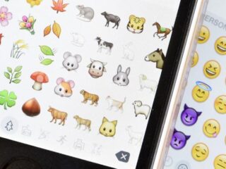 Apple gaat mondkapje-emoji vrolijker maken