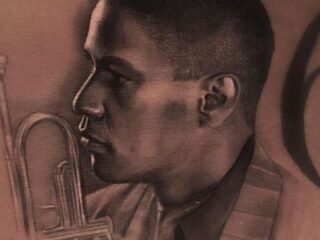 Drake zet tatoeage van Denzel Washington