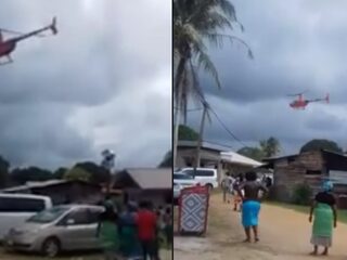 Surinaamse politicus strooit met geld vanuit helikopter