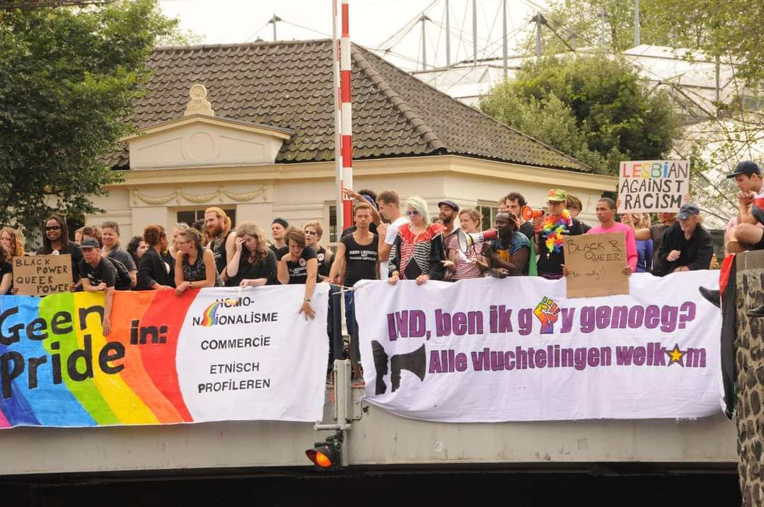 We Reclaim Our Pride banner drop Canal Parade