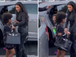 Zoontje Kim Kardashian en Kanye West steekt middelvinger op naar paparazzi