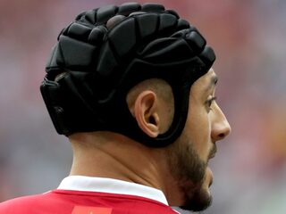 Helpt een helm voetballers met een hersenschudding?