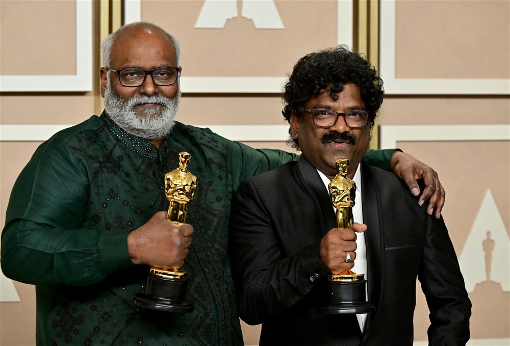 Indian musical composer M.M. Keeravaani (L) and Indian lyricist Chanrabose (R) pose with the Oscar for Best Music (Original Song) for their song "Naatu Naatu" in "RRR" in the press room during the 95th Annual Academy Awards at the Dolby Theatre in Hollywo